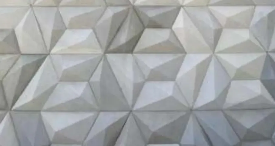 3D concrete wall panel with faceted relief pattern