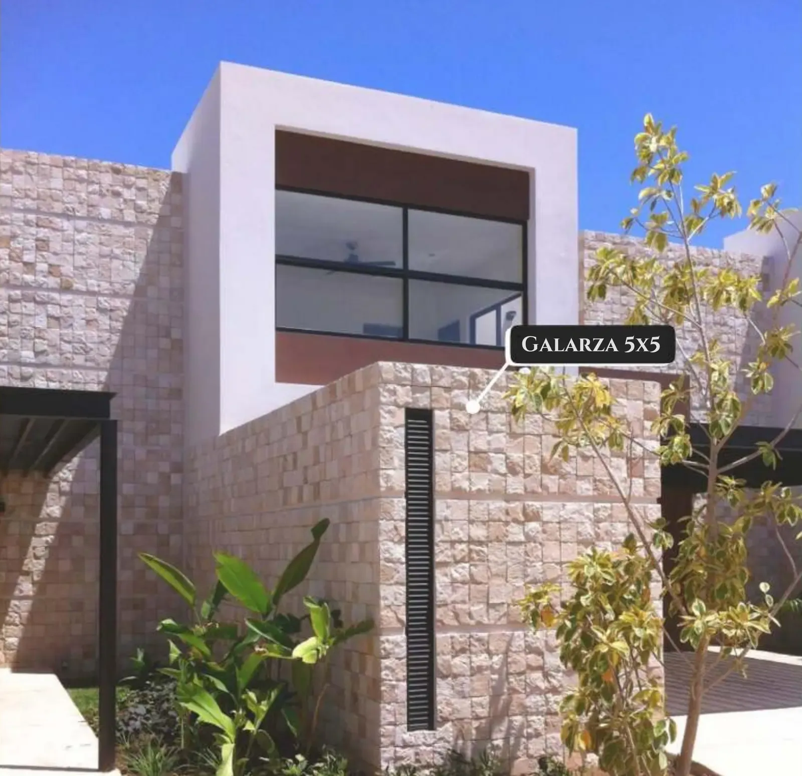 Modern multi-unit residential building clad in modular stone panels